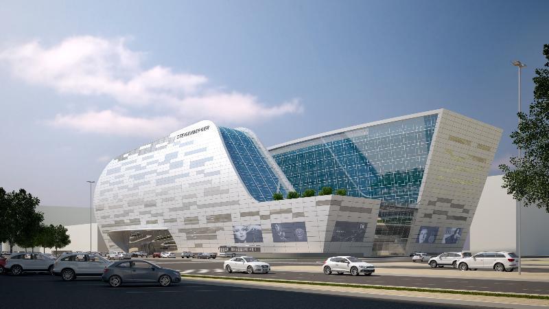 Steigenberger Hotel Doha Exteriör bild The image shows a modern architectural building with a futuristic design. The structure features large glass windows and a dynamic, flowing shape, combining different materials like metal and stone. There are green areas on the roof, and several scre